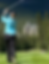 Woman playing golf with Fairmont Banff Springs in the background.