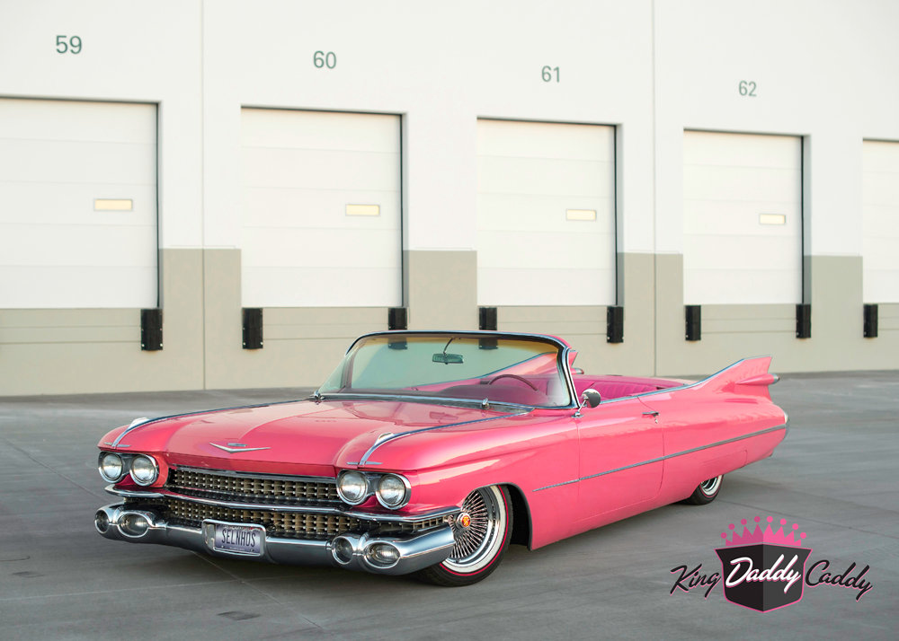 A Pink Cadillac with Red Stripe Vogue Tires