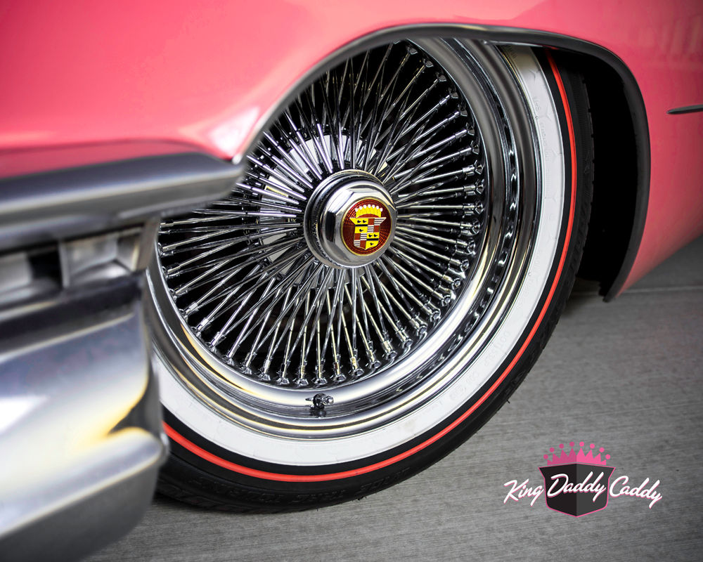 A Pink Cadillac with Red Stripe Vogue Tires