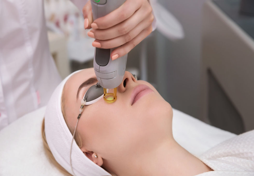 Close-up view of laser hair removal device on a treatment bed