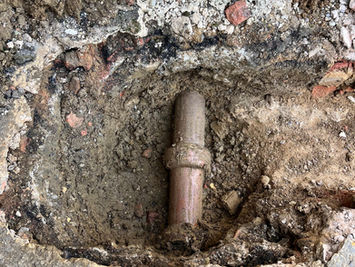 Attgills Drainage Services - Annex Drainage Northamptonshire - Exposed old clay drainage pipe revealed during excavation for annex drainage system upgrade.