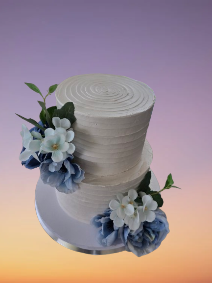 Thumbnail: White two-tier cake with blue and white flowers