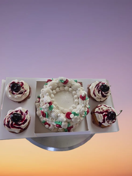 Thumbnail: Festive wreath cake and cherry-topped cupcakes on a platter