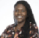 woman with braids facing forward and smiling