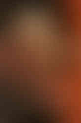 German Cover for Devil May Cry Volume 2. Dante is illustrated on the cover, in a fighting stance, holding high his sword, Rebellion. The title 'Devil May Cry 2' runs vertically downward on the right hand side in black. A red blood splatter streaks across the right side of the cover.