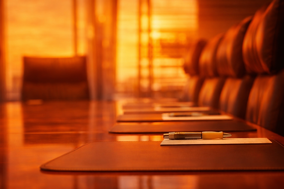 Elegant conference setting at sunset.png