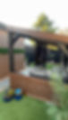 Custom designed pergola in a garden in Sandy
