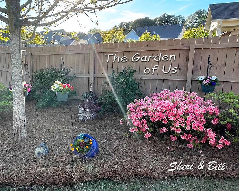 Image of backyard flower garden. Text on image says The Garden of Us (original photography by Sheri & Bill)