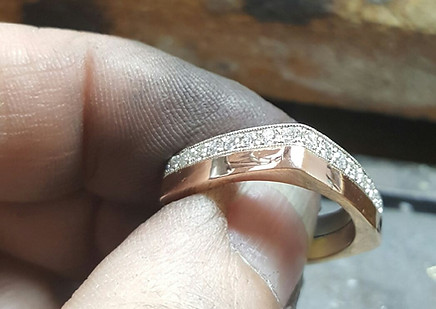 Rose gold square ring, with pave diamonds going all around. Looks like 2 separate rings together.