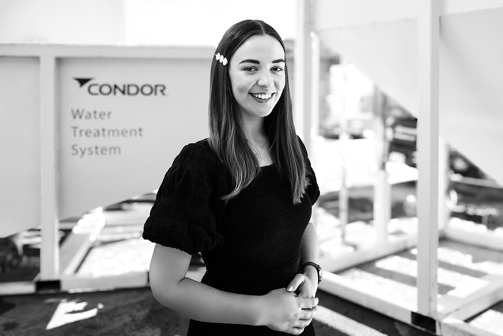 Two construction men talking next to Condor Civil's Water Treatment System