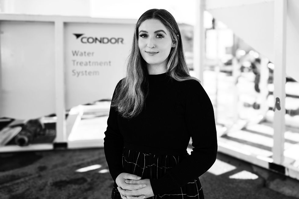 Two construction men talking next to Condor Civil's Water Treatment System