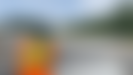 Cree ferry operator guiding boat across to Fort George Island for Mamoweedow Gathering.