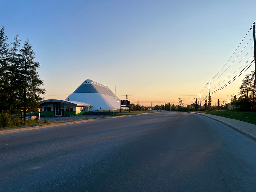 Evening sunset over Chisasibi cultural centre, pyramid-shaped building on Cree territory.