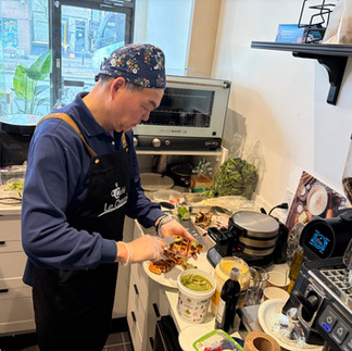 Staff member preparing croffles in the kitchen during menu testing at Café le Chemin