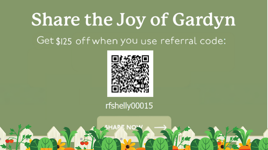 Image of a garden with various vegetables such as tomatoes, kale, and lettuce. Text on the image reads 'Share the joy of Gardyn - Get $125 when you use referral code: rfshelly00015