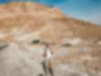 girl with backpack in masada national park