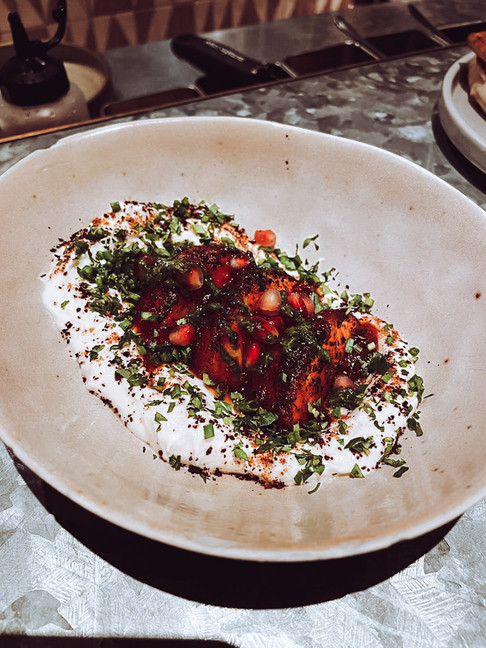 grilled peaches on yogurt on plate