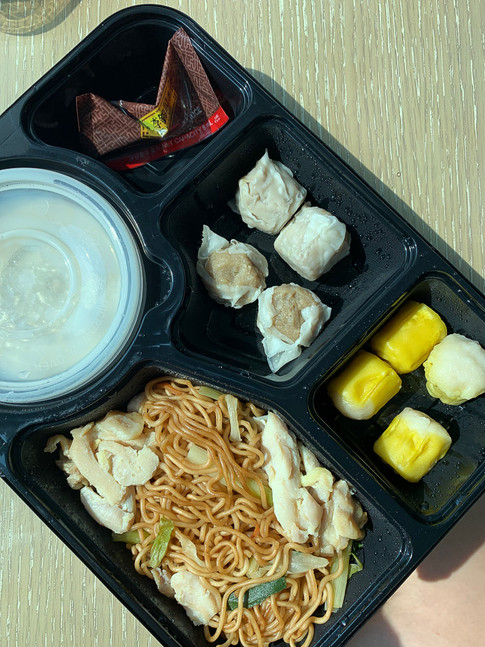 Hong Kong quarantine meal chinese dumplings and stir-fried noodles