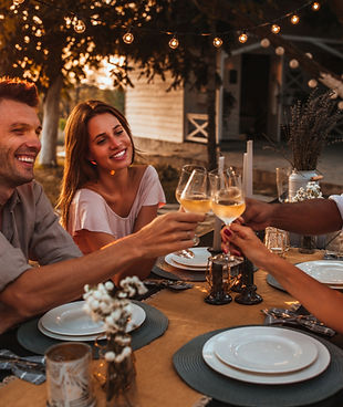 Friends toasting with glasses of white wine