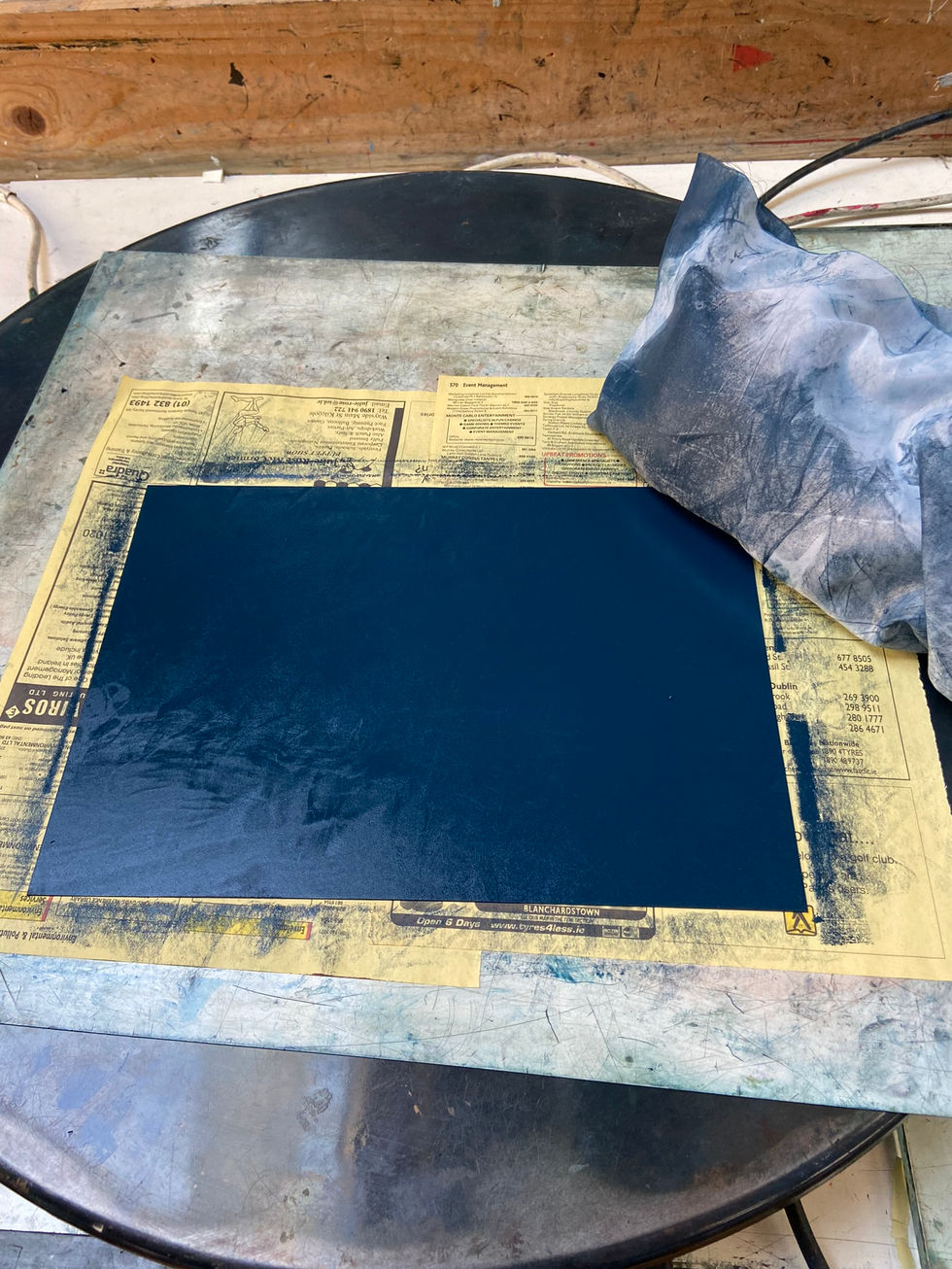 Photopolymer plate of 'Towards Dalkey' inked up, note cloth is then used to rub away excess ink. The plate is then pulled through the printing press by hand.
