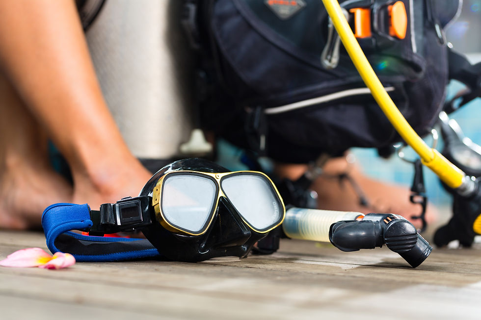 Eye-level view of scuba diving equipment neatly arranged on a boat deck