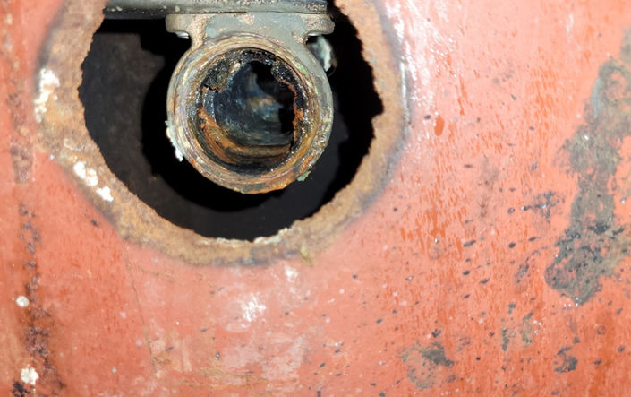 Jail cell sink/toilet connections have rusted through, and the threaded fittings on the specialized equipment are significantly eroded.