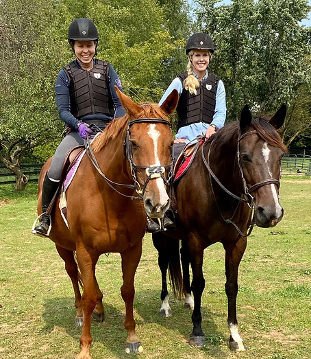 Sabrina and Adult Rider smiling.jpeg