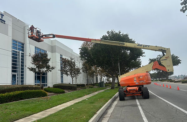 window cleaners on a boom lift in La Verne