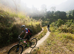 2 mountain bike riders on open trail in Nepal