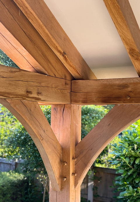 Custom oak porch joinery in a Cheshire home featuring brick exterior, by Woodwork Interiors.