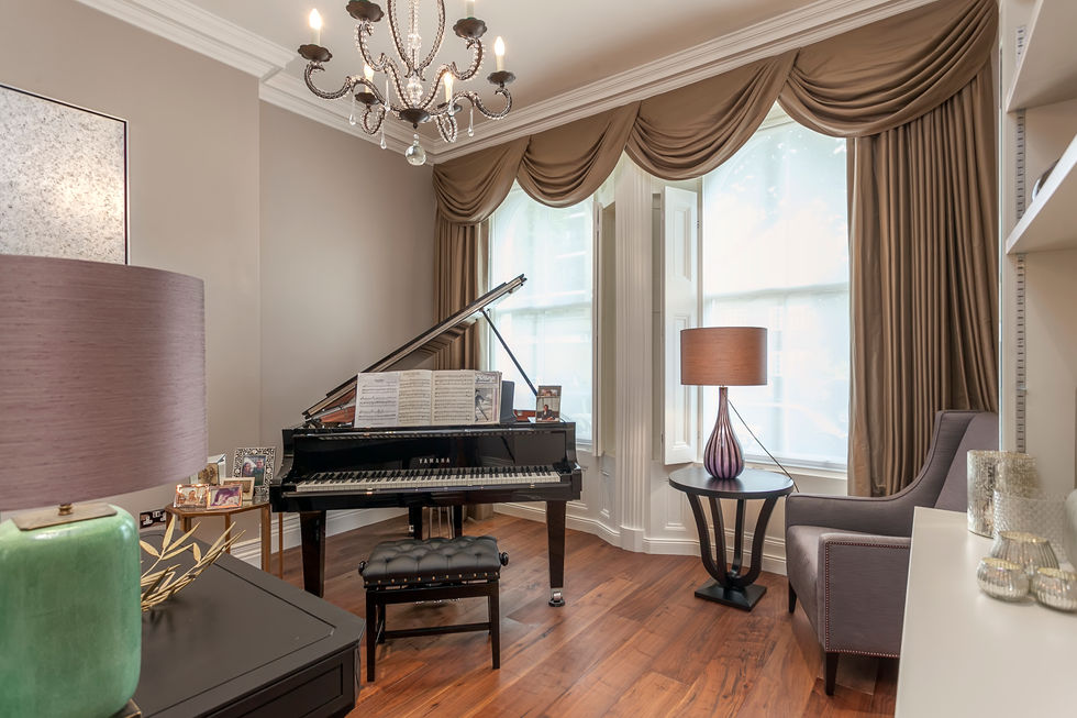 a yamaha grand piano sits in a living room