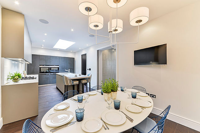 Open-plan kitchen and dining area with bespoke joinery, tailored storage solutions and contemporary finishes.