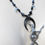 Thumbnail: Cat on a Broomstick Necklace w/mystic colored beads