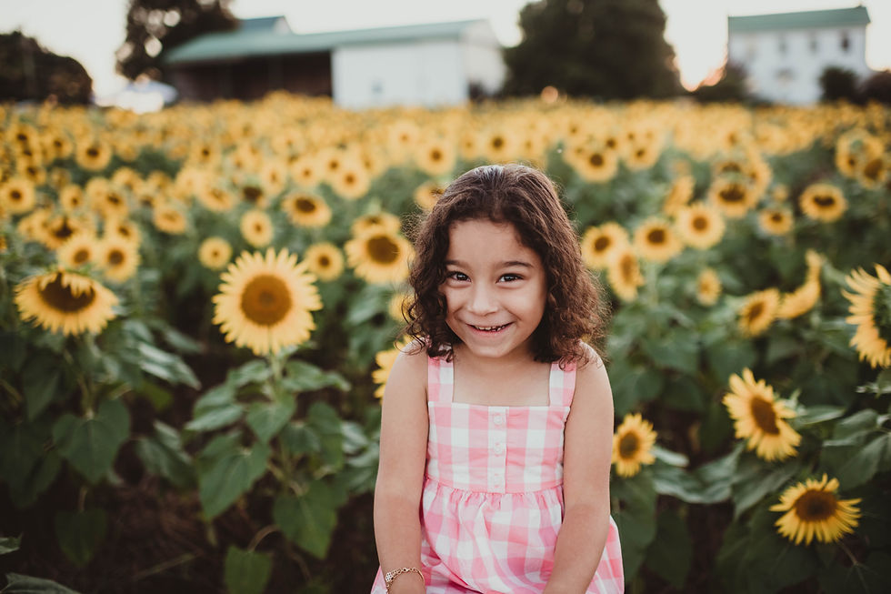 Close-up of hands holding sunflower during Maryland family photoshoot