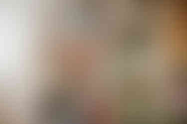 Baltimore newborn photographer studio shelves with soft newborn wraps and blankets in Cockeysville, MD