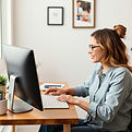 woman using her computer for a telehealth appointment .jpg