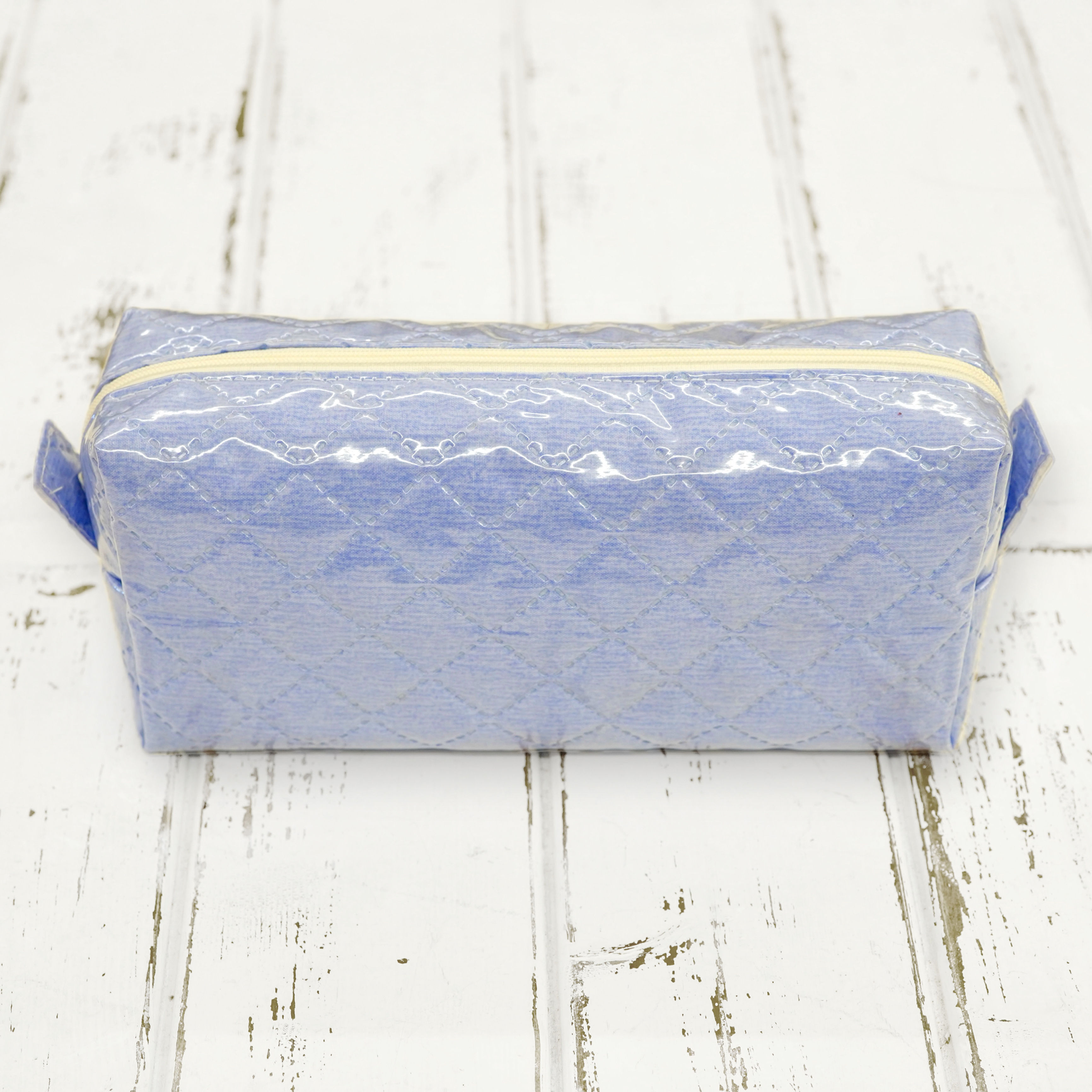 Neceser azul rectangular acolchado con plástico - interior plastificado