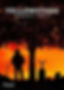 Cowboy standing in a cemetery under a tree at sunset.