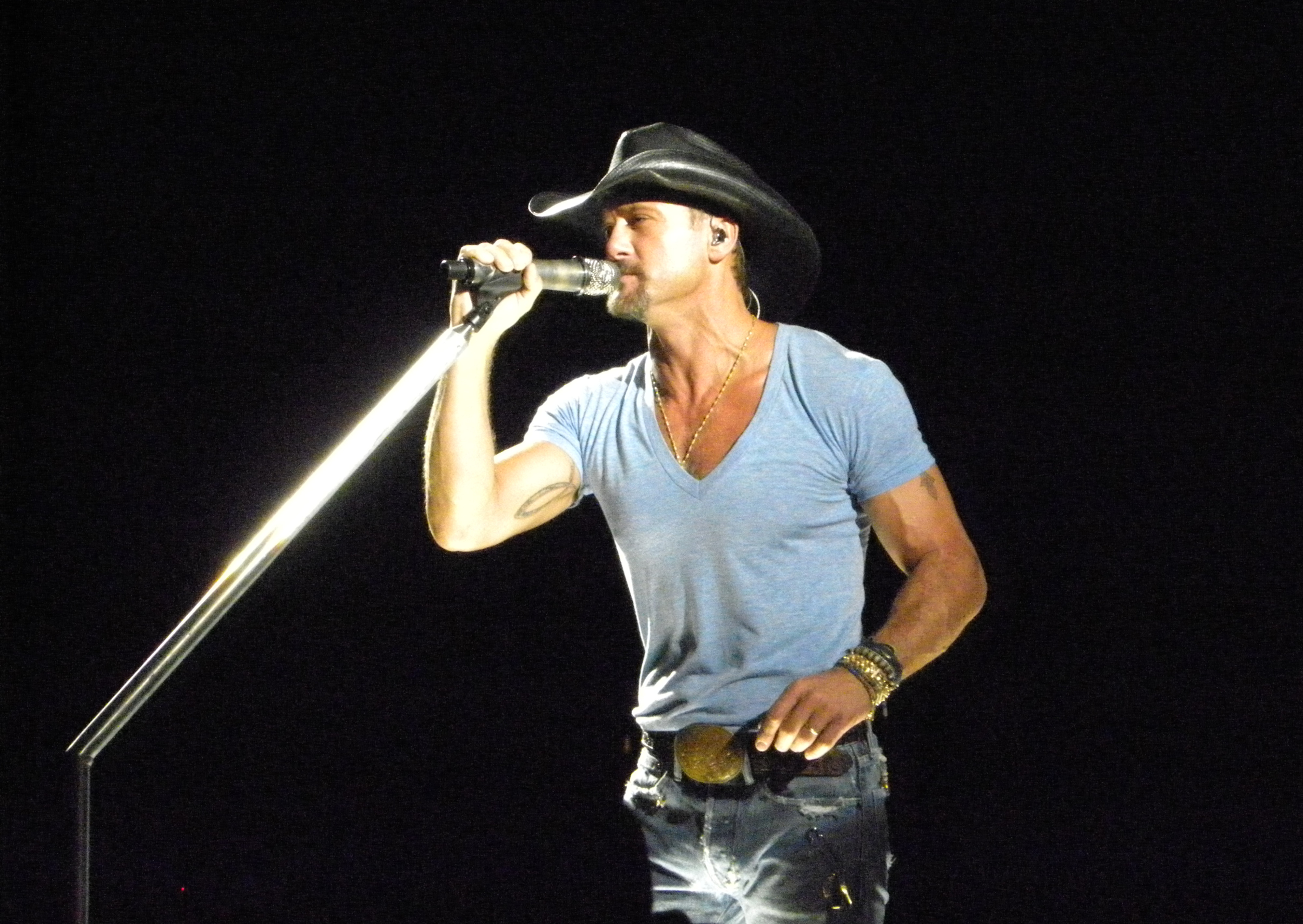 Tim McGraw performing on stage, the Louisiana-born country star who has never been inducted into the Grand Ole Opry