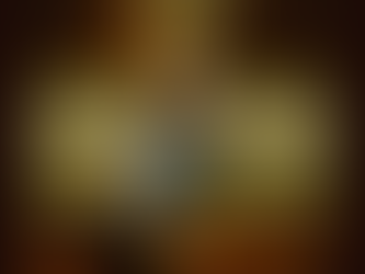 Kylie Frey on a couch covering her face with a cowboy hat