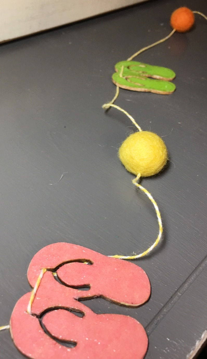 Thumbnail: Flip-Flop and Felt Ball Banner