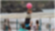 a boy spiking the ball during a game of 9 square volleyball