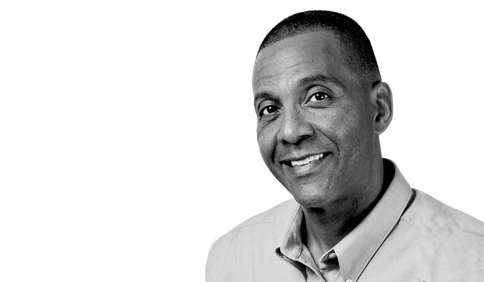 Picture of Kevin P. Henry with a soft smile and kind eyes. Left side of picture has words that read, "building bridges to engagement."