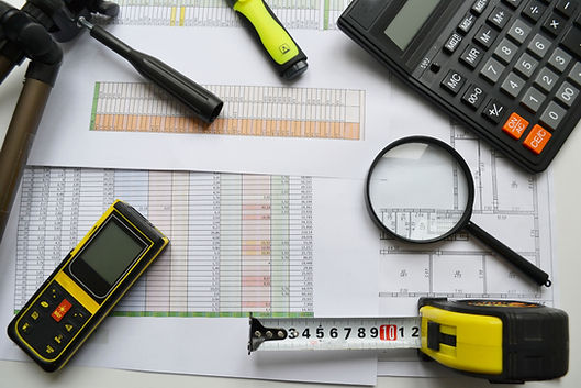 measuring tape, calculator, laser rangefinder and plans. Construction control..jpg