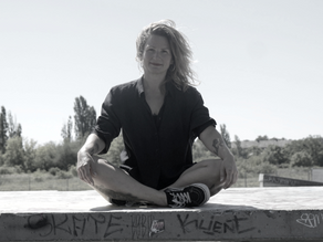 Verena sitting relaxed in cross legged seat.