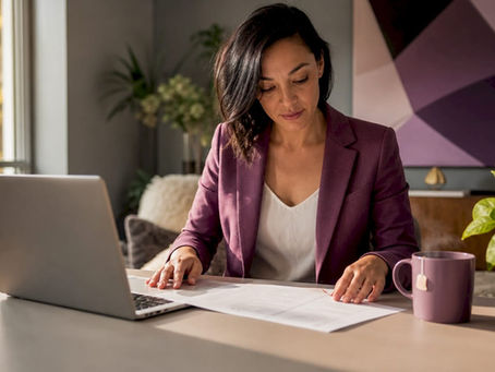 Business owner reviewing remote staffing contracts