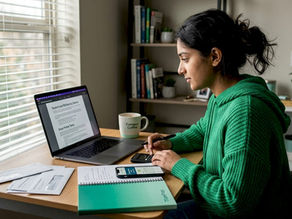 Student reviewing loan documents at kitchen table