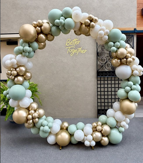 Circular balloon arch in mint, gold, and white