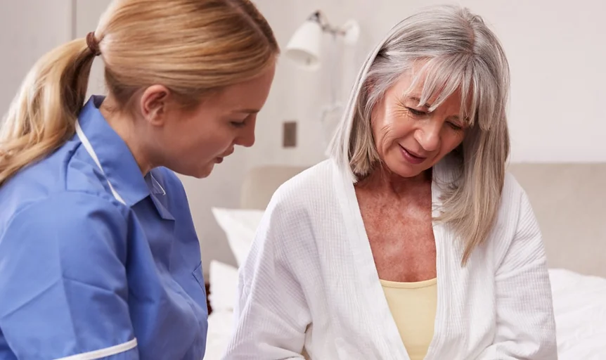 healthcare recruitment agency worker assisting a patient