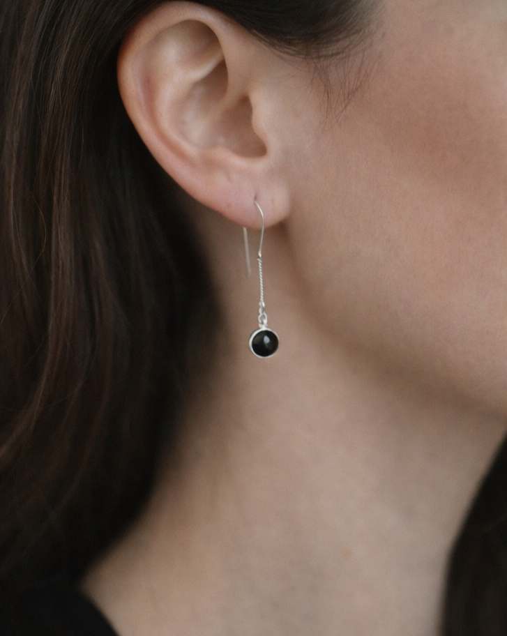 Black onyx earrings shown on model